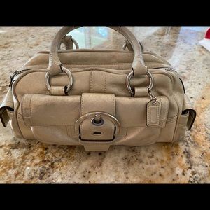 Coach Bag.  Gold approx 14 x 7 with two handles. 3 outside pockets. Super cute!